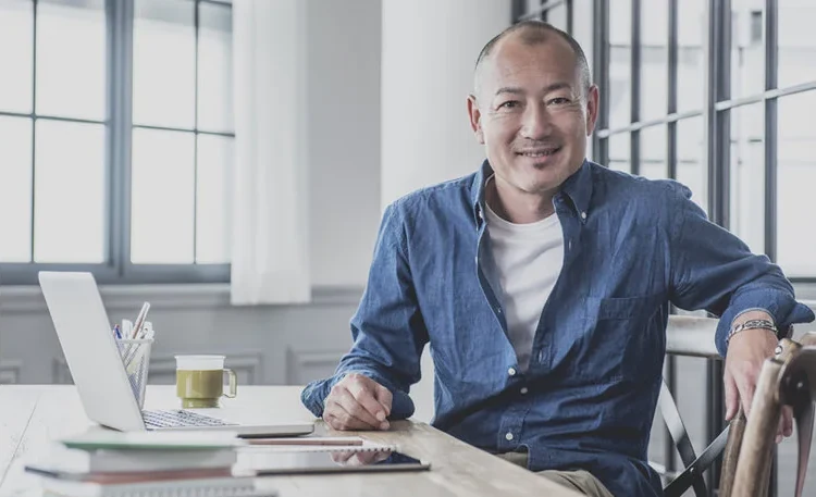An executive reviewing portfolio decisions at his desk